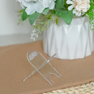 Clear acrylic mini book stand detail, transparent display holder for small books.