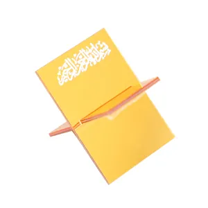 Yellow acrylic book and date holder, elegant desktop decorative stand with Arabic script detail.
