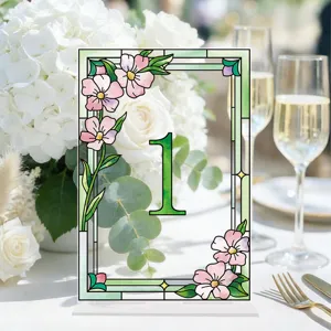 Detailed view of the acrylic table number sign with floral stained glass design for wedding.