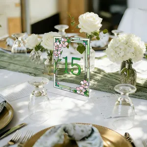 Acrylic wedding table number sign with stained glass floral design, elegant party decor stand.