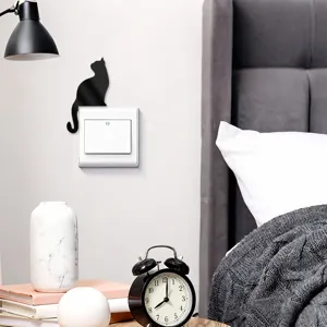Acrylic mirror cat wall switch sticker, cute cat decor for home bedroom interior design.