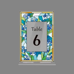 Blue stained glass floral acrylic table number sign for wedding party decor detail view.