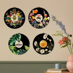 Boho style round wooden wall art decor featuring botanical flowers and vintage record designs.