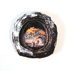 Detailed view of wooden tree hollow hedgehog magnetic sticker, cute nature decor craft.