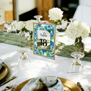 Acrylic wedding table number sign with blue stained glass floral border and clear digit 18.