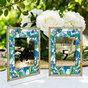 Acrylic table number signs with stained glass floral design for wedding party decoration.
