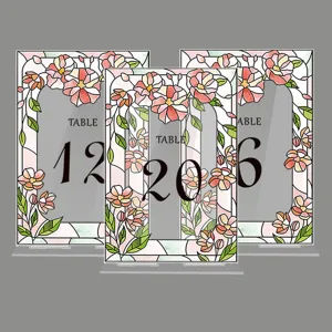 Acrylic wedding table number signs with floral stained glass design for party event decoration.