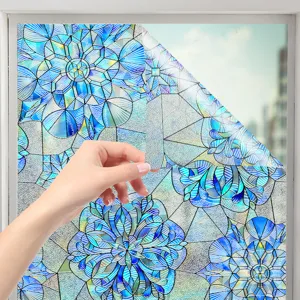 Close up view of blue floral stained glass window film being peeled to show texture.