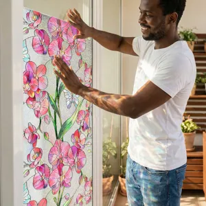 Close-up detail of 3D embossed pink orchid window film applied on clear glass for home decor.