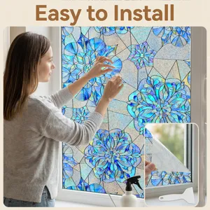 Detail view showing the 3D embossed blue floral window film applied on home glass easily.