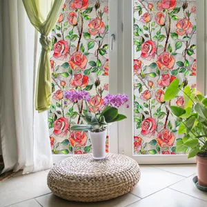 Detailed scene showing decorative rose window film applied on glass, adding floral elegance.