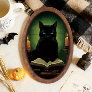 Detailed view of a vintage oval wooden Halloween picture frame with black cat art.