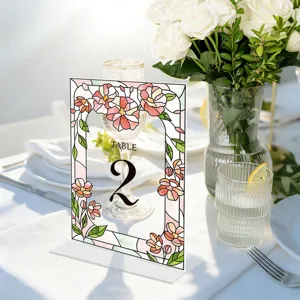 Acrylic wedding table number sign with stained glass floral border, perfect for party decor display.