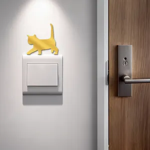 Gold acrylic cat wall switch sticker detail view, elegant home decor accent for interior walls.