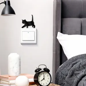 Acrylic cat switch sticker detail showing cute wall decor design for modern bedroom interior.