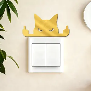 Gold acrylic cat switch sticker detail shot showing humorous wall decor design for modern homes.