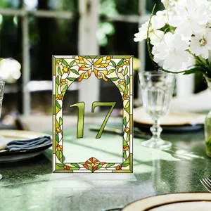 Stained glass style acrylic table number sign with butterfly design for wedding party decor.