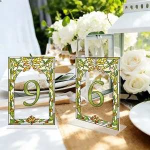 Acrylic wedding table number sign with floral butterfly stained glass design for party.