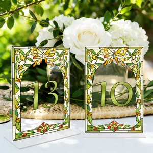 Acrylic table number sign with stained glass butterfly design for wedding party decor.
