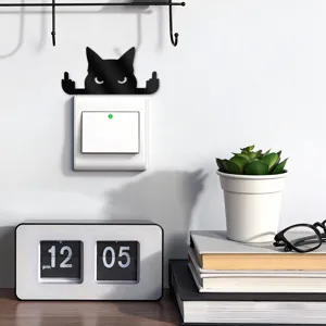 Funny black acrylic cat switch sticker detail scene showing wall decor application.
