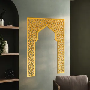 Detailed view of gold acrylic wall sticker with geometric Islamic arch pattern on gray wall.