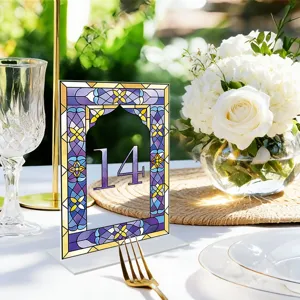 Close up of a stained glass style acrylic table number sign 14 for wedding party decoration.