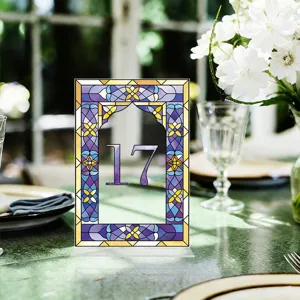Acrylic wedding table number sign with colorful stained glass style border and number seventeen