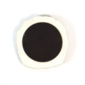 Wooden fridge magnet back detail, natural wood slice with circular magnetic backing.