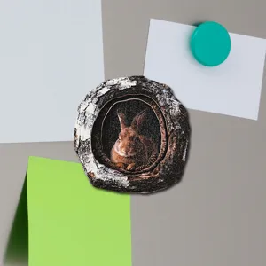 Close-up of the wooden tree hollow rabbit fridge magnet, showing realistic texture on magnetic surface.