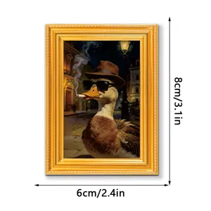 Detailed view of the funny duck fridge magnet in a vintage golden wooden frame, nice home decor.