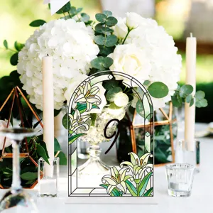 Detailed view of the stained glass style acrylic wedding table number sign with lily floral.