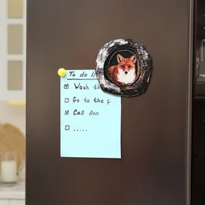 Wooden tree hole fox fridge magnet magnetic home decoration showing detail on refrigerator door.