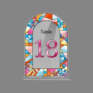 Acrylic arched table number sign with colorful stained glass floral border for wedding party decor.