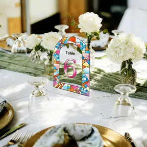 Acrylic arch table number sign with stained glass floral border for wedding party decor.