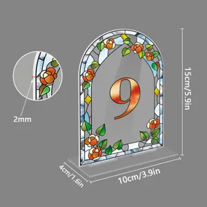 Acrylic arched table number sign with floral stained glass design for wedding party decor.