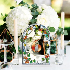 Acrylic arched table number sign detail, wedding party floral stained glass decor display.