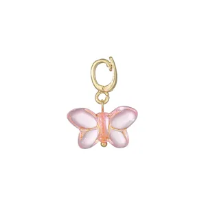 Charming pink glazed butterfly pendant with gold universal clasp for DIY jewelry making.