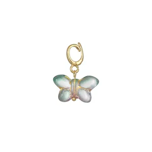 Close up detail of the glazed butterfly pendant with gold clasp, perfect for DIY jewelry making.