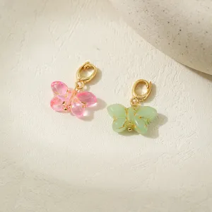 Close-up of exquisite glass butterfly pendant charm, featuring detailed gold-tone clasp.