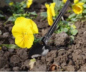Portable folding tactical shovel with black finish, ideal for camping, gardening and outdoor adventures.