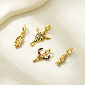 Vintage Western style pendant set featuring Hamsa hand and bull skull charms for DIY jewelry.