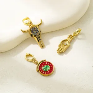 Vintage western style DIY charm pendants set including bull skull and hamsa hand designs.