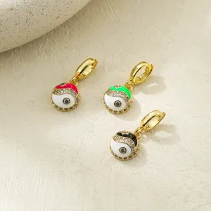 Main image showing three colorful enamel yin yang tai chi charm pendants with gold plated bail.