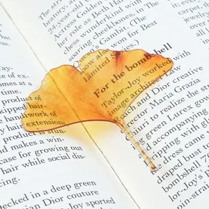 Translucent acrylic bookmark with yellow leaf design, aesthetic page marker for books.