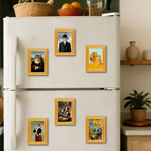 Detailed shot of funny cat art refrigerator magnets set on white fridge surface in kitchen scene.