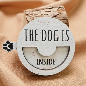 Wooden magnetic pet status sign detail shot, showing the rotatable disc design and clear paw print.
