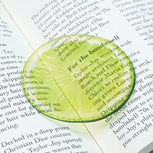 Translucent round acrylic bookmark featuring a fresh green lime slice pattern and stylish text.