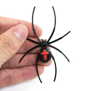 Close-up view of a 3D printed black spider fridge magnet with red accent, perfect for Halloween.