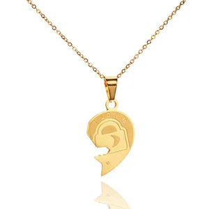 Gold titanium steel heart lock puzzle necklace pendant detail showing engraving craftsmanship.
