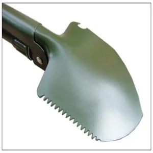 Close-up detail of green folding tactical military shovel with serrated edge for outdoor camping.